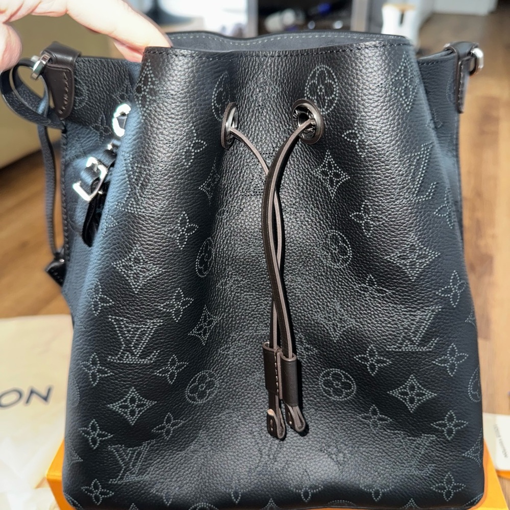 Louis Vuitton Muria black perforated leather silver hardware